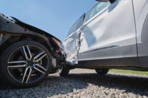 Two vehicles damaged in a collision after a crash, illustrating claims pursued by a Longmont car accident lawyer.