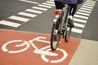 Cyclist riding over a bike lane | motorcycle accident lawyer | The Law Offices of Edward Smith LLC