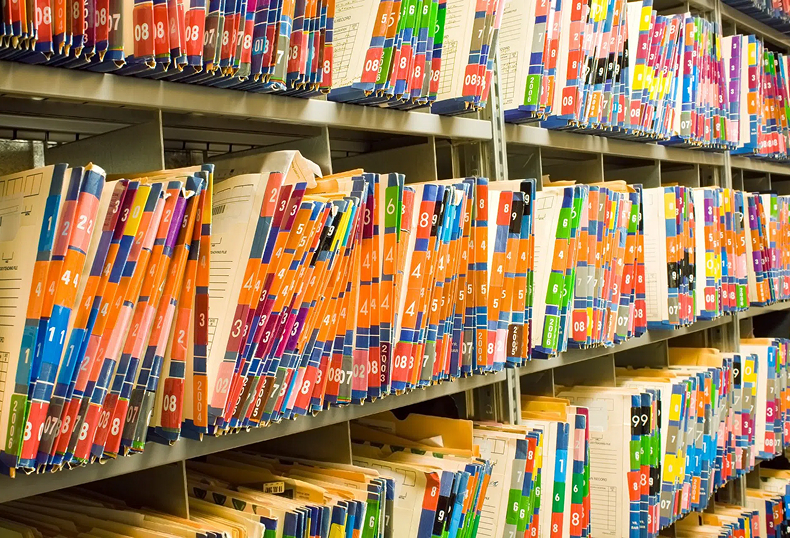 Color-coded files stacked | premises liability lawyer | The Law Offices of Edward Smith LLC