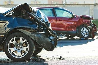 Two badly damaged cars after a collision | car accident lawyer | The Law Offices of Edward Smith LLC