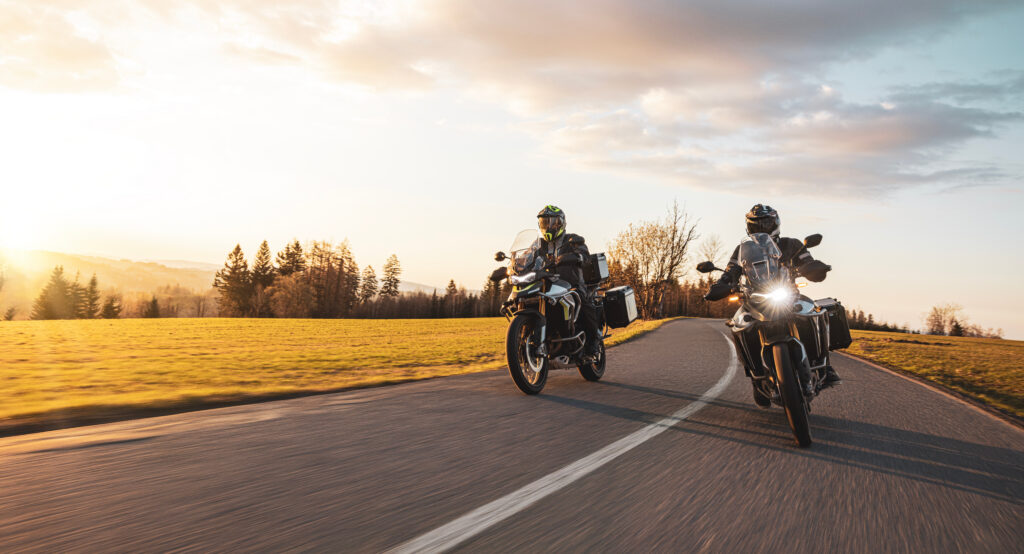 Motorcyclists riding at sunset | motorcycle accident lawyer | The Law Offices of Edward Smith LLC