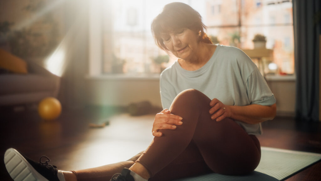 Woman grimacing in pain | personal injury lawyer | The Law Offices of Edward Smith LLC
